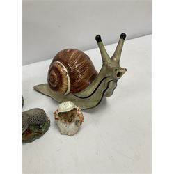 Two Beswick figures compirisng Beatrix Potter 'Mrs Tiggy Winkle' and Beneagles Scotch Whisky badger, together with a Garniers Liqeurs decanter modelled as a snail, etc