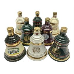 Bells, Scotch whisky, in eight Wade ceramic decanters, to include Christmas 2002, Christmas 1990, Christmas 1994 etc, all 70cl, 40% vol  