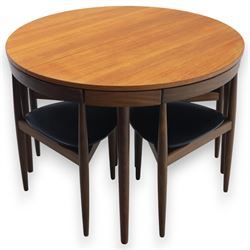 Frem Røjle - Danish teak 'Roundette' extendable dining table, circular top with softly chamfered edge and internal stowable leaf extends to 156cm, raised on four tapered cylindrical legs, accompanied by four matching dining chairs with shaped teak frames and black vinyl upholstered seats, the chairs designed to nest beneath the table when not in use