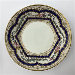 Sèvres soft paste porcelain coffee can and saucer with date code for 1767, painted with floral and laurel leaf garlands within blue scalloped and gilt borders, interlaced LL monogram enclosing the date letter O above painters mark for Catrice, coffee can H7.5cm, saucer D15cm