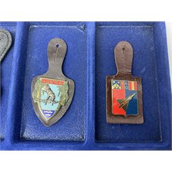 Twelve French military metal badges mounted on leather fobs including Legion, Artillery, Parachutist, Air Force, Infantry etc
