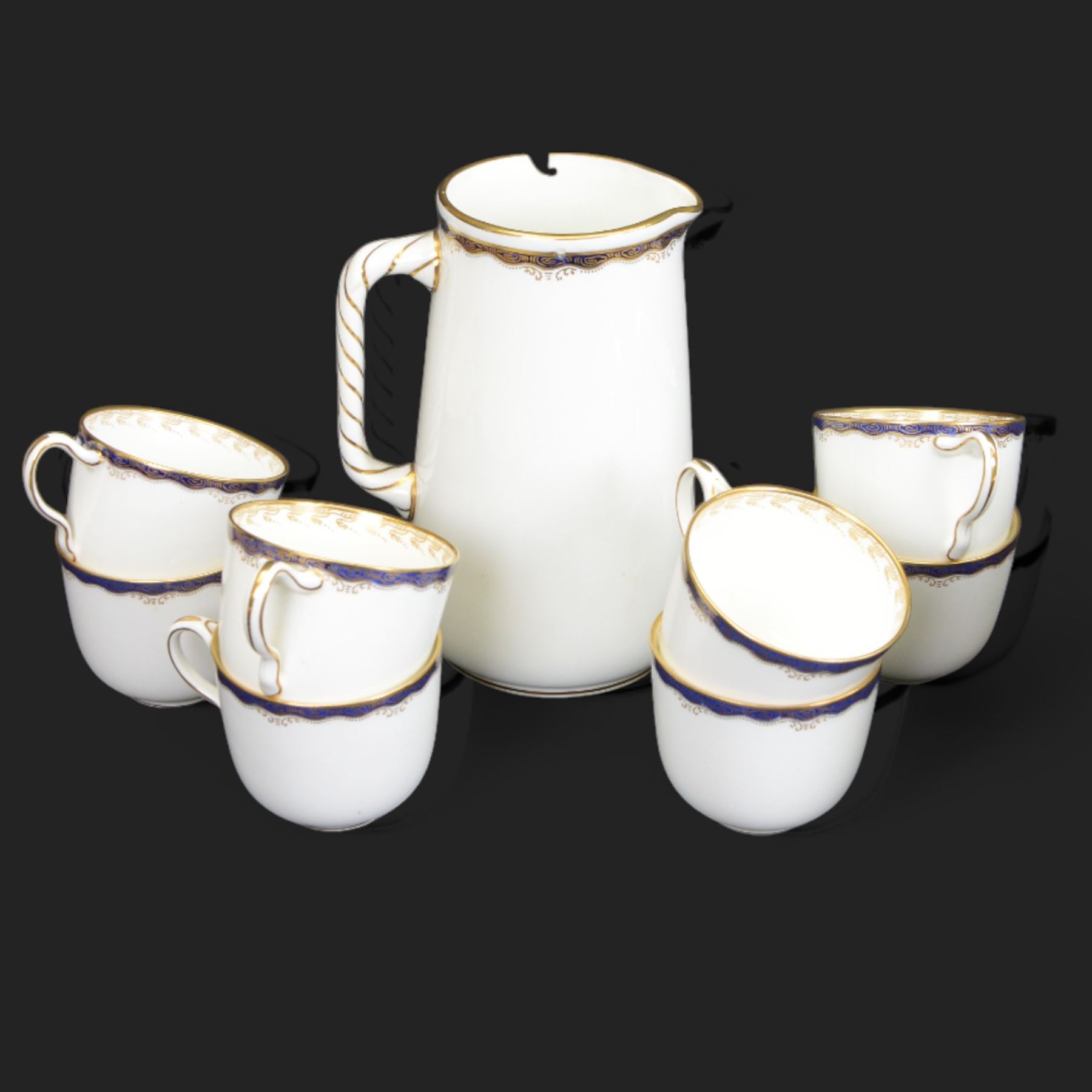 Wedgwood tea service, comprising teapot and stand, hot water jug, milk jug, open sucrier, twelve side plates, two sandwich plates, twelve cups and eleven saucers 