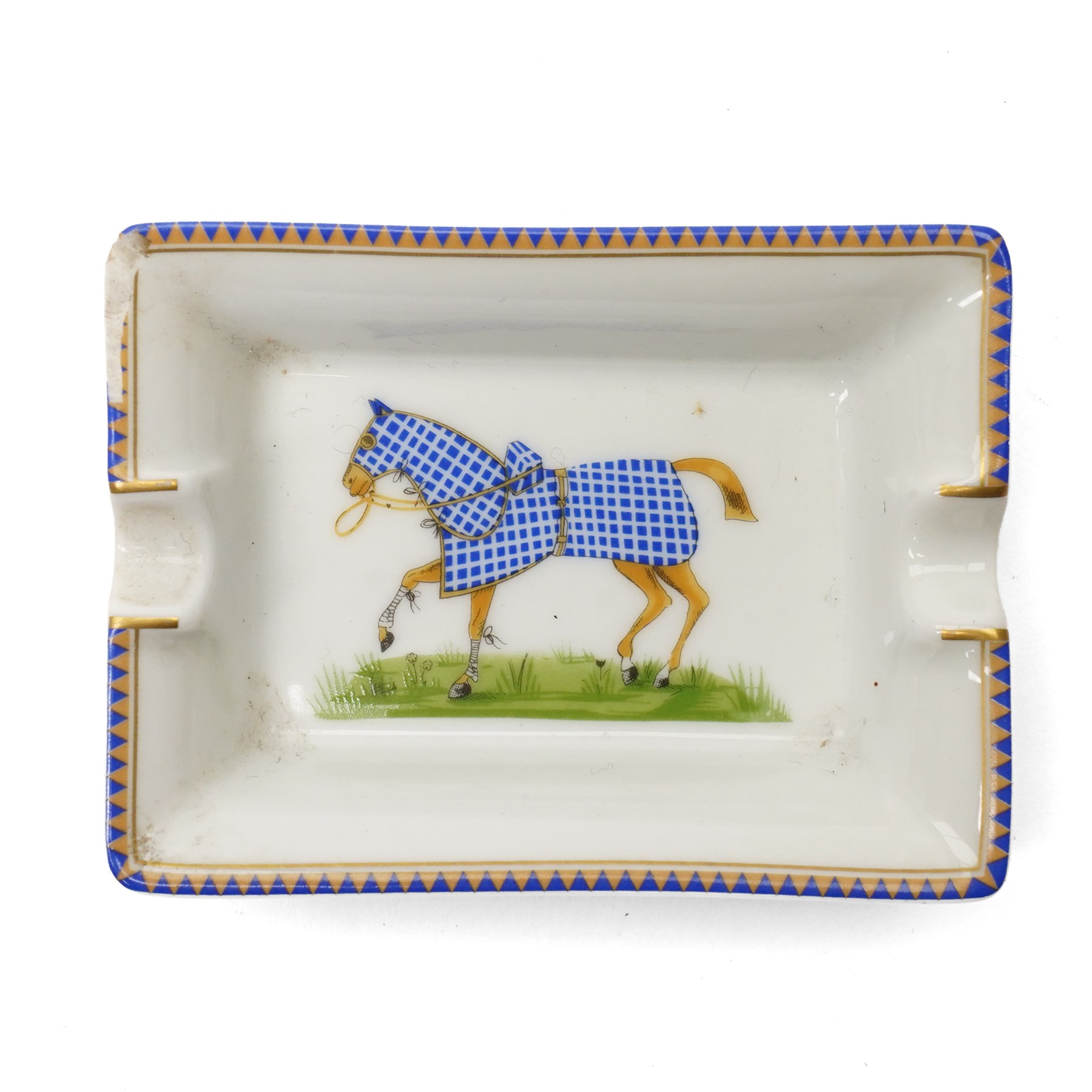 Hermès - set of four miniature porcelain ashtrays, each decorated with a horse in differing blanket, with gilt and coloured borders, in contrasting colour with various horse-coats, in original fitted box