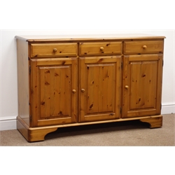  Ducal pine dresser, two glazed doors with central shelves, above three drawers and three cupboards, on shaped bracket supports, W132cm, H190cm, D45cm Ducal pine sideboard with three drawers above three cupboards, on shaped bracket supports, W132cm, H87cm, D45cm  