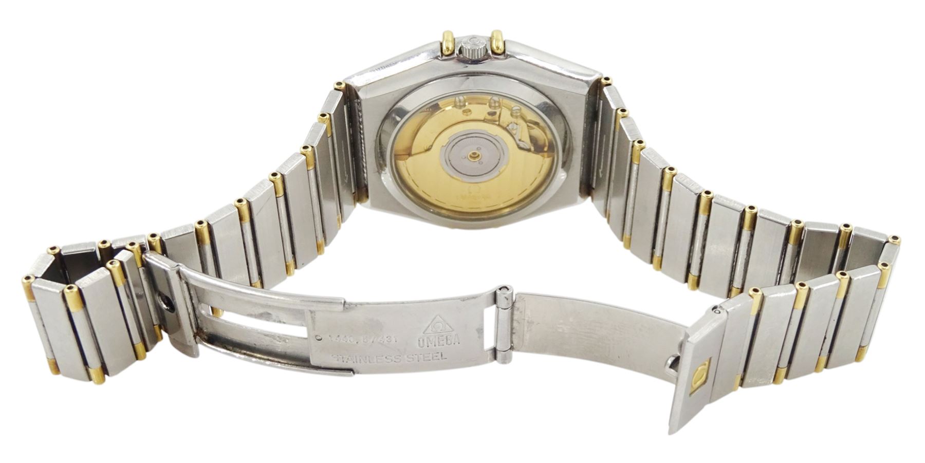 Omega Constellation gentleman's stainless steel and gold automatic chronometer wristwatch, Ref. Cal. 1111, serial No. 49547890, white dial with date aperture and exhibition back case, on integral bracelet No. 1448.5/431, with fold-over clasp