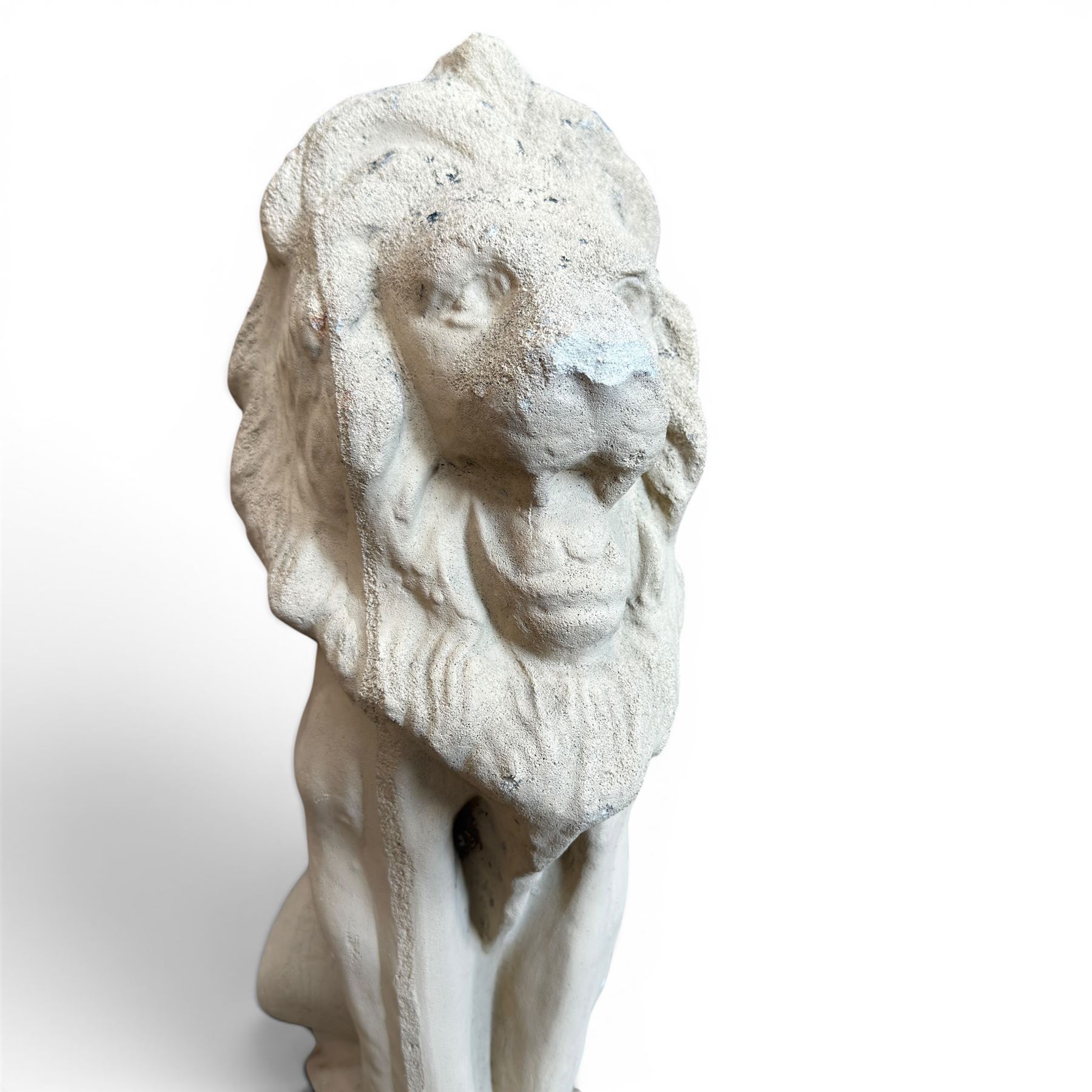 Pair of cast stone seat lions, male and female figure, and a miniature pair of cast stone lions