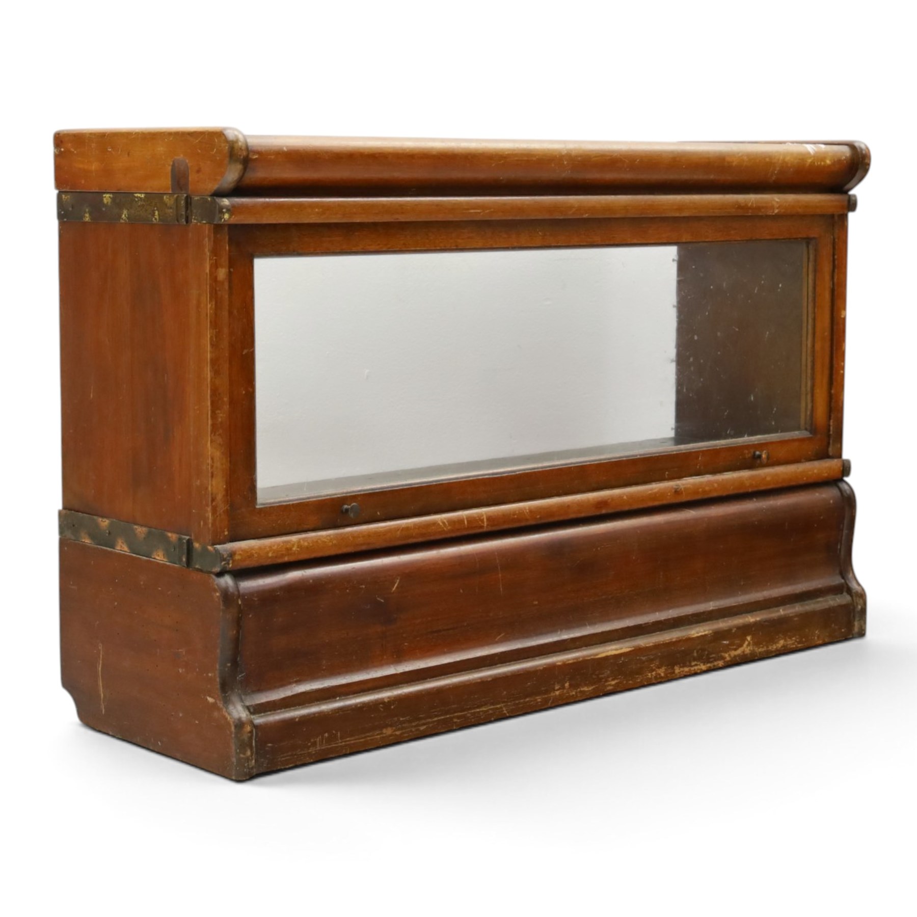 Globe Wernicke - early 20th century mahogany two-tier stacking library bookcase, fitted with glazed up-and-over doors, two drawers to the plinth base; together with a similar single-tier example (W87cm D27cm H54cm)