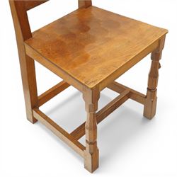 Mouseman - pair of oak panel back side chairs, adzed panel back and seat, on octagonal supports, with carved mouse signature, by the workshop of Robert Thompson of Kilburn
