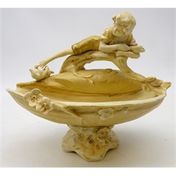  Royal Dux figural footed bowl decorated with a young boy laid on a branch, L24cm   