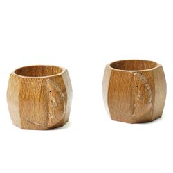 Mouseman - pair of oak napkin rings of octagonal design with carved mouse signature from t...