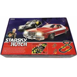 Scalextric - Marks & Spencer Starsky & Hutch set with '76 Gran Torino and Chevrolet Corvette cars, boxed; an earlier Tri-ang Scalextric 'Set 30' Model Motor Racing set containing Lotus and Cooper racing cars with controllers, track, figures and instruction pack, boxed; and a Scalextric catalogue Fifth edition c1964