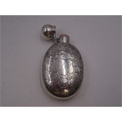 Victorian silver hip flask, of oval form, with engraved foliate and scroll decoration, and monogrammed shield shaped cartouche to centre, with plain collar and cap, H11cm, hallmarked Chester 1899, maker's mark worn and indistinct, together with an Edwardian silver glasses case, of oval form, with engraved foliate and scroll decoration, and monogrammed circular shaped cartouche to centre, with opening to top, revealing velvet lined interior, with silver shield clip, H17.5cm hallmarked to case and clip Sanders & Hill,  Birmingham 1908, with a pair of gold plated glasses 