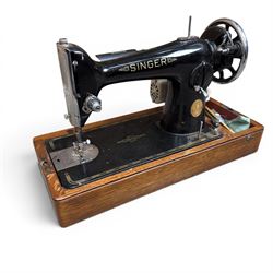 Three Singer wooden cased sewing machines 