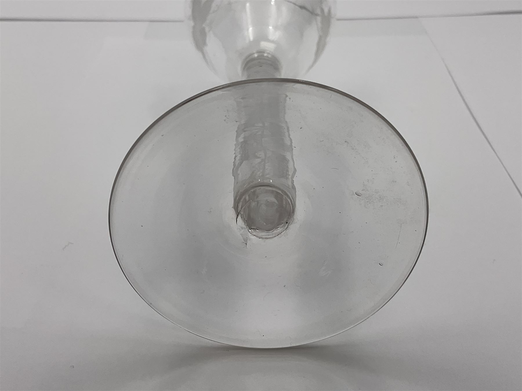 Set of three 18th century style wine glasses, each with funnel bowl etched with fruit vine, upon a double series air twist stem and circular foot, H17cm