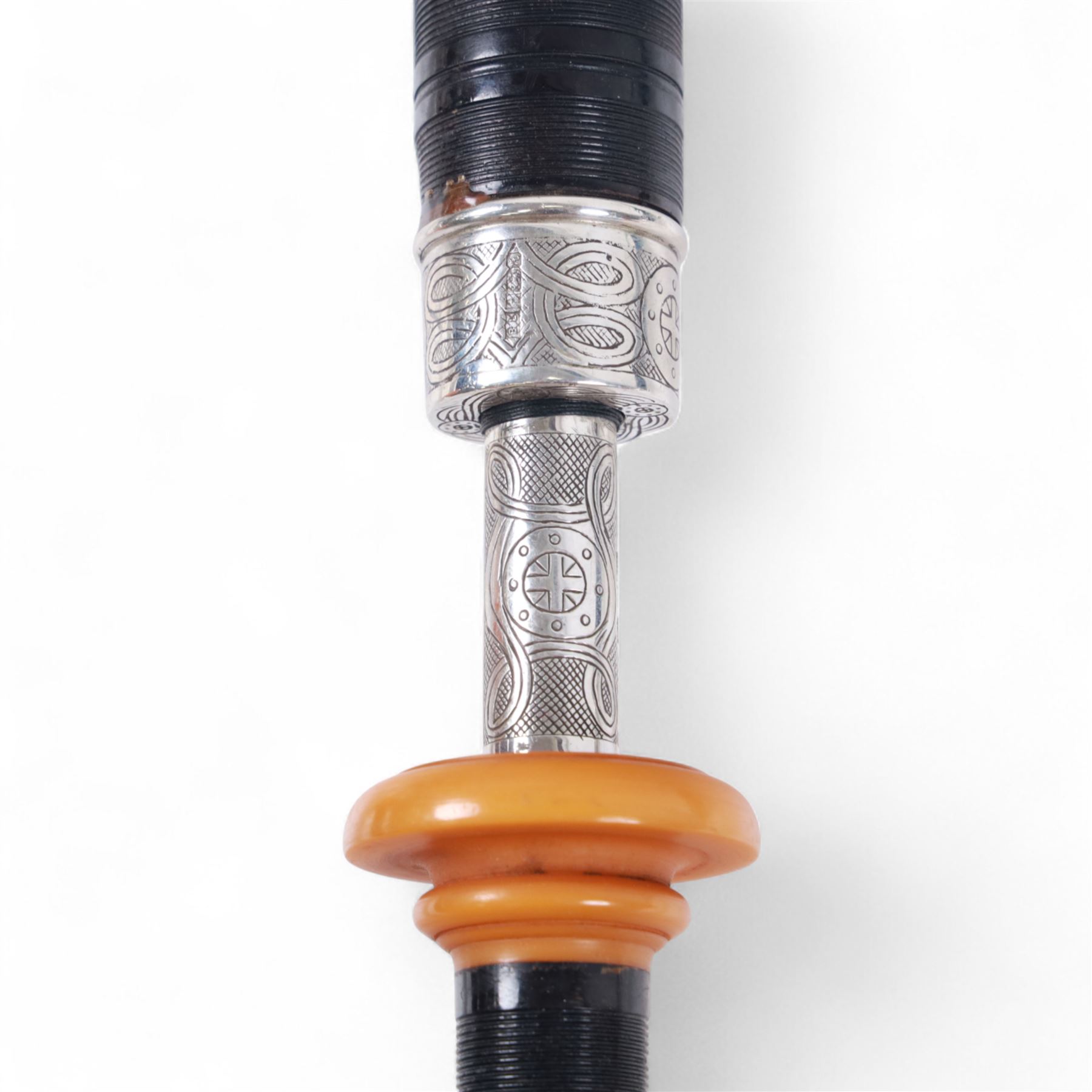 Set of late 20th century silver mounted bagpipes, the turned ebonised hardwood drone rods with Celtic knot and stipple engraved silver collars and ivorine mounts, hallmarked Bernie Leigh, Birmingham 1991, with R.G Hardie Glasgow plastic chanter and bag in green and blue Armstrong tartan, contained within a plush lined hard case, with a collection of spare reeds, drone rods, chanter, bags, cleaning accessories and other accessories 