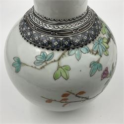 Pair of Chinese Republic porcelain vases, each painted in Famille Rose enamels with pairs of pigeons amidst peony, rock, flowering plants and leafy branches, possibly Qianlong seal beneath, H22cm 