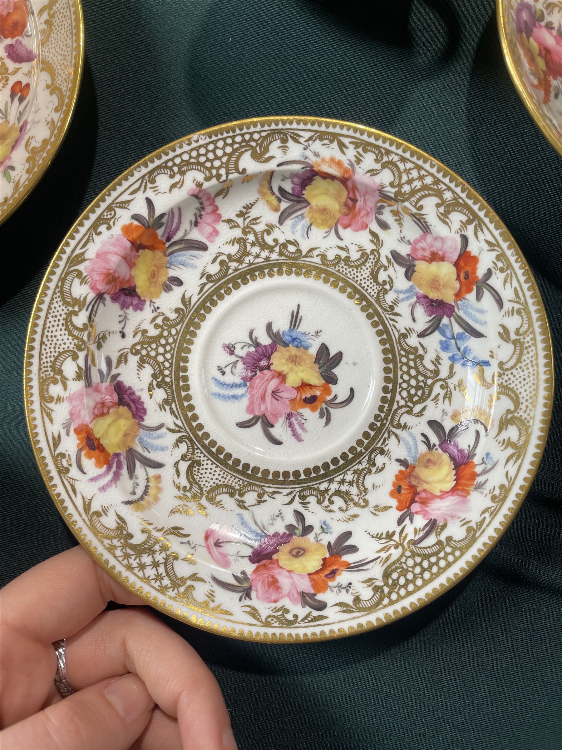 Coalport tea and coffee cups, pattern no. 830, decorated with sprays of flowers within gilt borders, comprising three teacups, four coffee cups and five saucers, with another matched teacup and saucer 