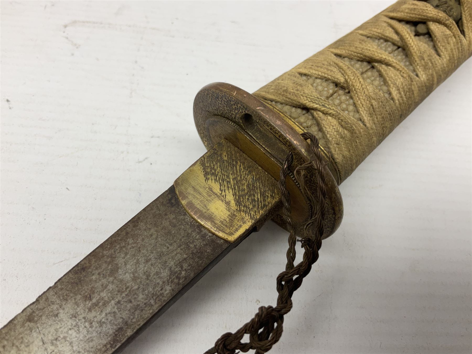Japanese tanto dagger with 25cm single edged blade, gilded plain punched tsuba, cord bound ray skin grip incorporating menuki and ornate gilded metal mounts L39cm overall