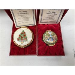 Eight Christmas themed Halcyon Days enamel boxes, and a Halcyon Days enamel bonbonniere modelled as a snowman, each in fitted box 