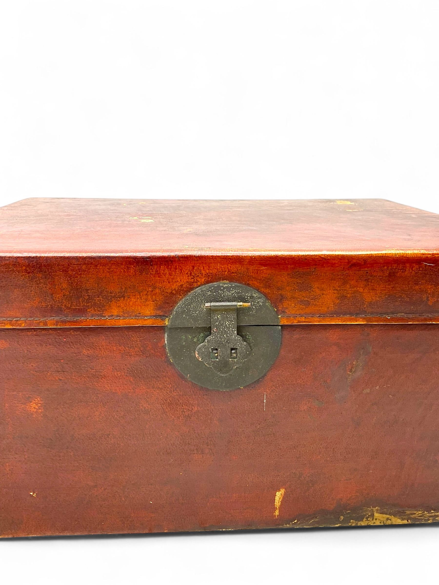 Pair of Chinese 18th century hand-painted leather-bound wooden trunks, each adorned with metal locks, twin carrying handles and patterned fabric-lined interior