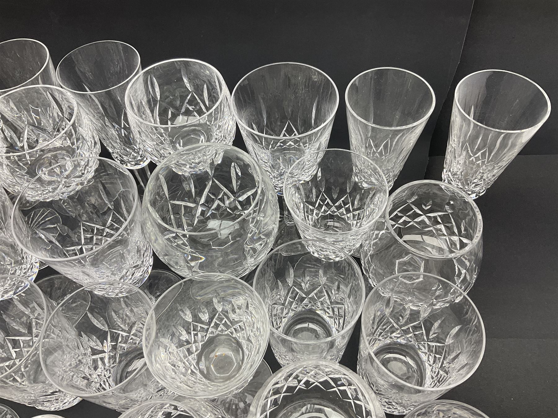 Set of Waterford Crystal Lismore pattern drinking glasses for six people, including hock glasses, goblets, champagne flutes,  sherry glasses, liqueur glasses, hi ball glasses, whisky glasses, brandy balloons, etc, all with etched maker's mark beneath  (62)