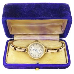 Omega early 20th century 9ct gold manual wind wristwatch, silvered dial with Arabic hour markers and subsidiary seconds dial, London import mark 1921, on expanding gold bracelet, stamped 9ct, boxed