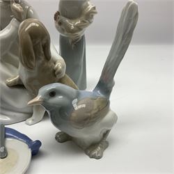 Three Lladro figures, comprising Bird no 1054, Shepherdess with rooster no 4677 and Boy with Dog no 4522, together with a Nao figure 