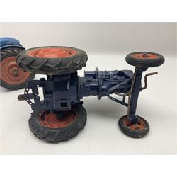 Chad Valley - two unboxed and playworn large scale Fordson tractors - No.9235 Fordson Major Tractor, dark blue diecast body, orange wheels, crank handle clockwork mechanism and 'Firestone' rubber tyres; and No.M59 New Fordson Major Tractor, blue diecast body, tinplate hinged bonnet, orange wheels and clockwork motor contained in rear wheel hub (2)