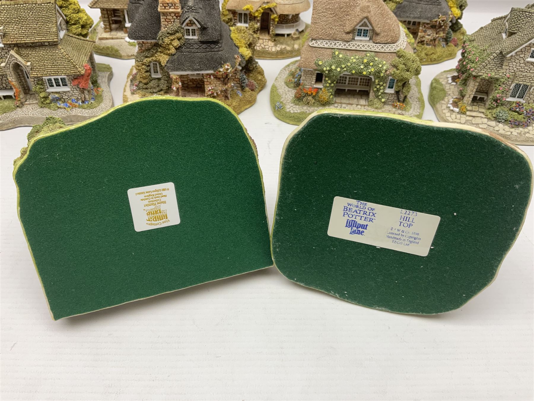 Eight Lilliput Lane limited edition Beatrix Potter models, including Buckle Yeat, Tabitha Twitchits Shop and Ginger Pickles Shop, together with twelve Lilliput Lane models from the Blaise Hamlet collection, including Dial Cottage, Diamond Cottage and Vine Cottage, all with deeds and original boxes (20)