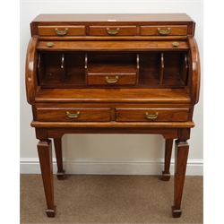  Polished hardwood tambour top desk, fitted drawers with brass handles, on square supports with spade feet, W81cm, H108cm, D43cm  
