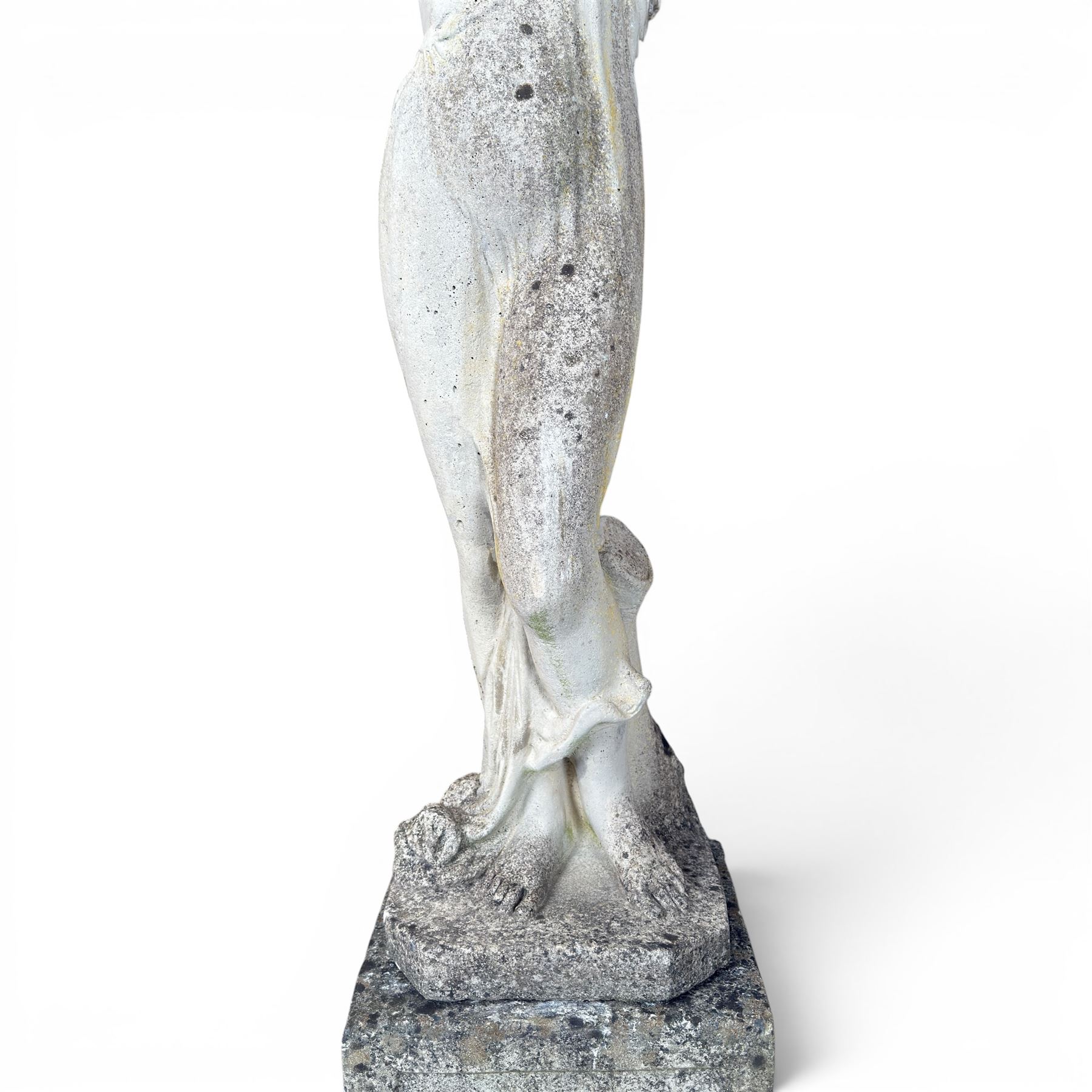 Weathered cast stone garden statue of a 'Shy Maiden', raised on square plinth base