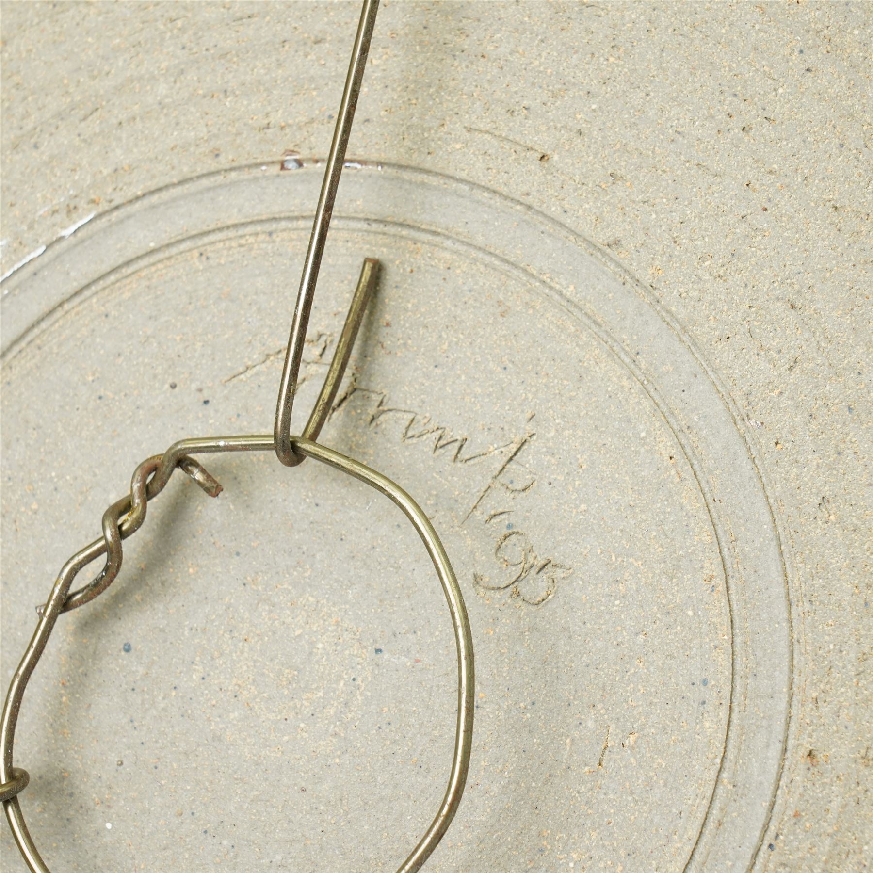 Mick Arnup (British 1925-2008): stoneware wall charger, decorated in mottled glaze with abstract decoration, incised signature to base, D45cm