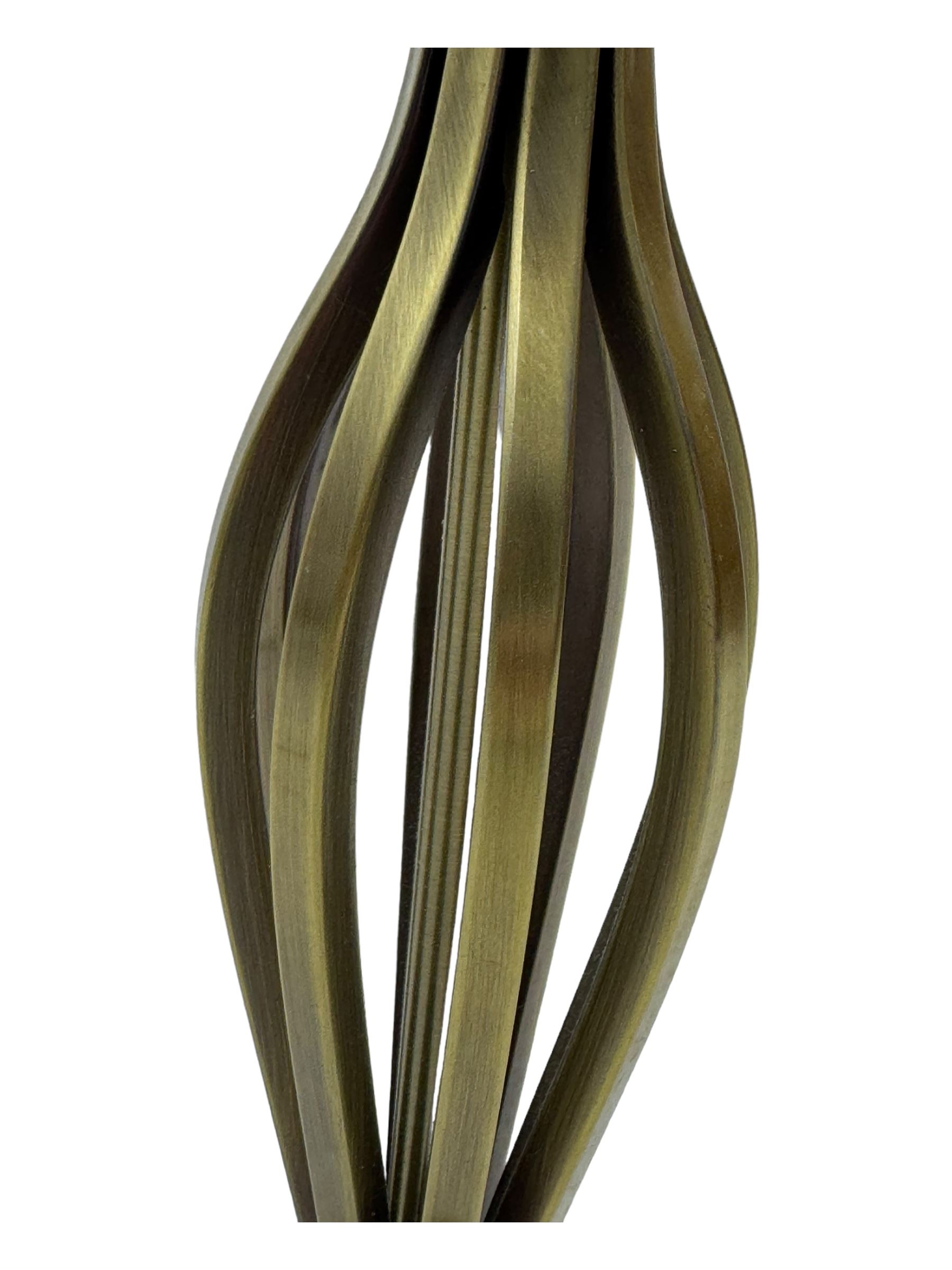 Contemporary brushed metal standard lamp, brass effect with cylindrical stem, on circular base, H131cm; matching table lamp, H35cm (2)