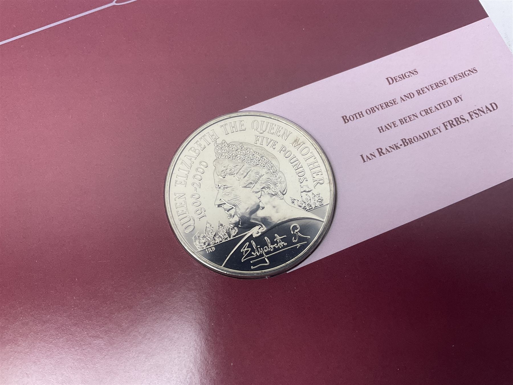 Eleven Queen Elizabeth II cupronickel five pound coins, in card folders or on cards