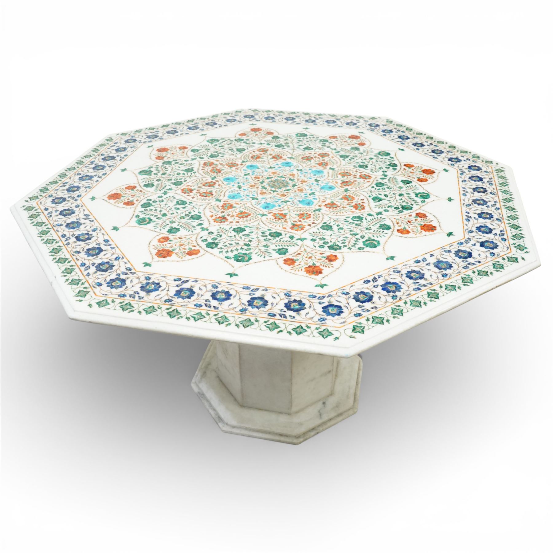 20th century Florentine design composite marble pietra dura centre table, octagonal white marble top inlaid with a polychrome foliate and floral medallion centred by a rosette, within a conforming floral border, raised on a faceted octagonal marble pedestal and stepped base