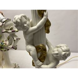 Jaffe Rose figural ceramic table lamp, modelled as two putti climbing a column with gilded cloth, together with a Capodimonte floral two light table lamp and a collection of lamp shades