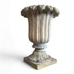 Cast stone tulip urn, petal rim with bell shaped bowl on squat base, stamped HGC; with ass...