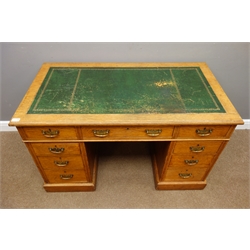  Late 19th century oak twin pedestal desk, nine drawers, green inset leather top, W123cm, H73cm, D66cm  