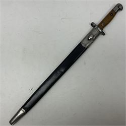 WW1 British pattern 1907 bayonet in polished condition with 43cm fullered steel blade by Sanderson, various marks to ricasso including date 12-14; in steel mounted leather covered scabbard L58cm overall