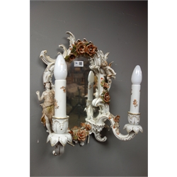  Pair 20th century German porcelain twin branch mirrors by PMP, the scroll frame having encrusted flowers and applied maiden and cherub figures, H46cm   