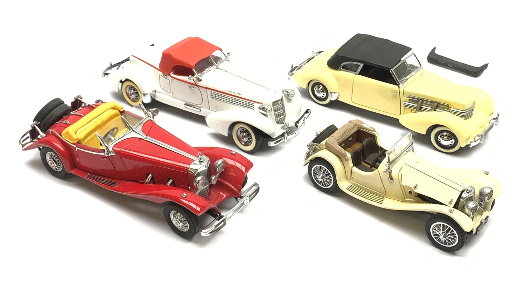 Four Franklin Mint die-cast model cars comprising 1935 Auburn 851 Speedster, 1937 Cord 812, 1935 Mercedes Benz 500K Special Roadster and 1938 Jaguar SS-100, all in polystyrene packaging, all but Jaguar with paperwork (4)
