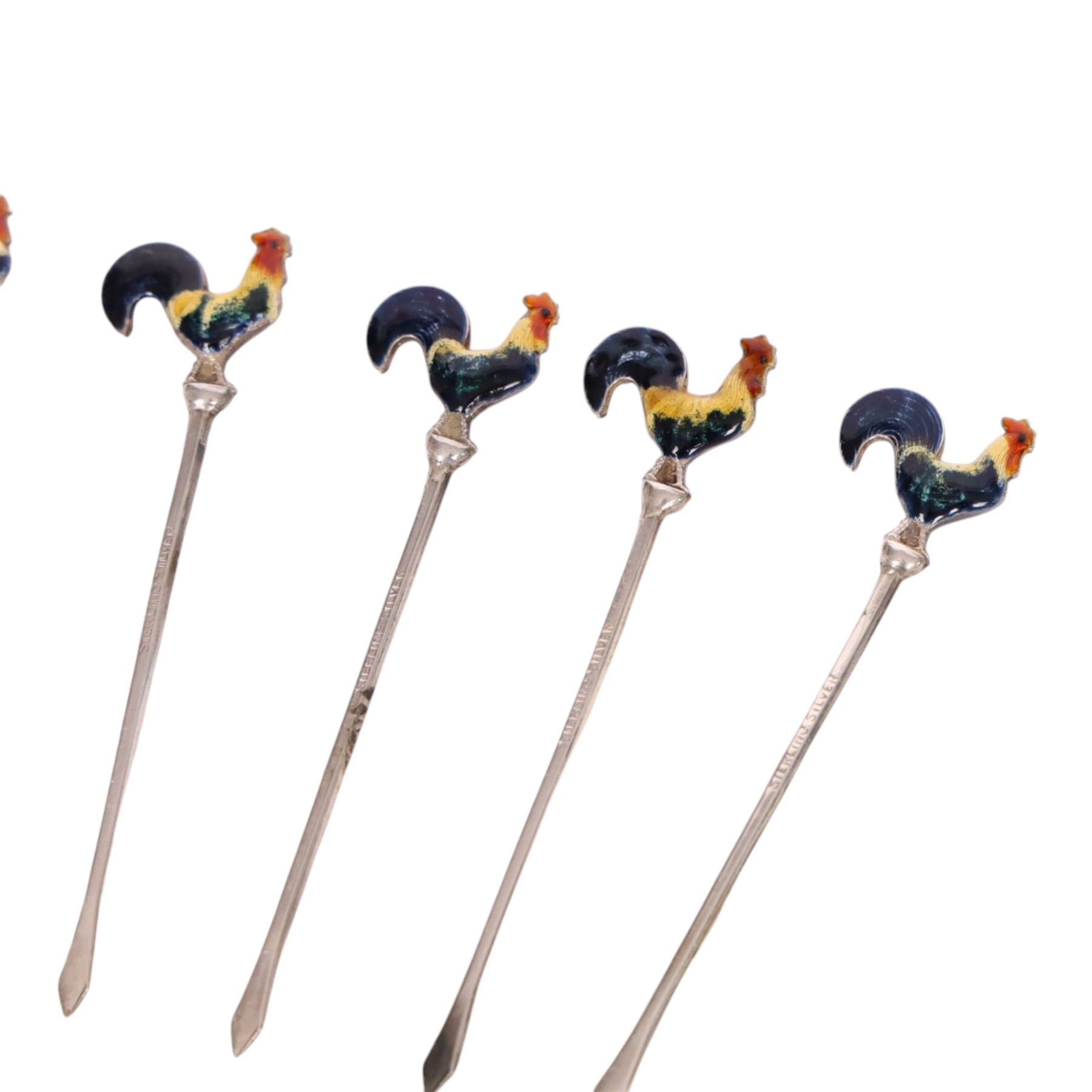 Set of six early 20th century silver cocktail sticks with enamel cockerel finials, stamped Sterling Silver