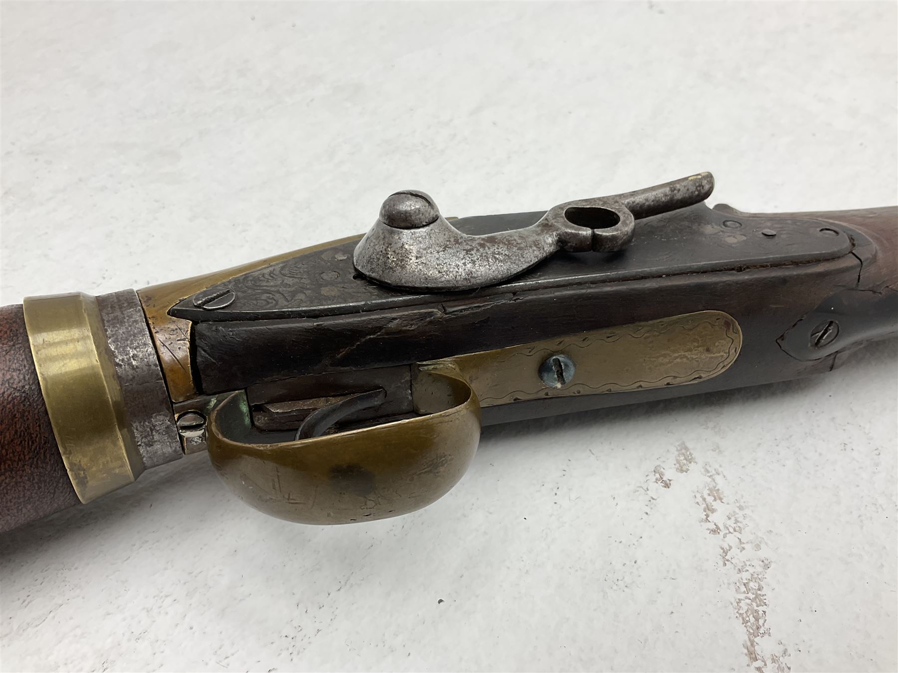 Late 18th century 7.2mm (approx. .28 calibre) Girandoni system single shot reservoir air rifle, the 62cm steel barrel with swivelling two-leaf rear sight, brass breech decorated with a sunburst and lever opening top loading, engraved steel lock-plates marked 'S. Gaskell' to the right side underneath the cocking lever, brass trigger guard,  leather covered steel butt reservoir of tapering conical form with brass ferrule and walnut fore-stock with horn mounts L107cm overall