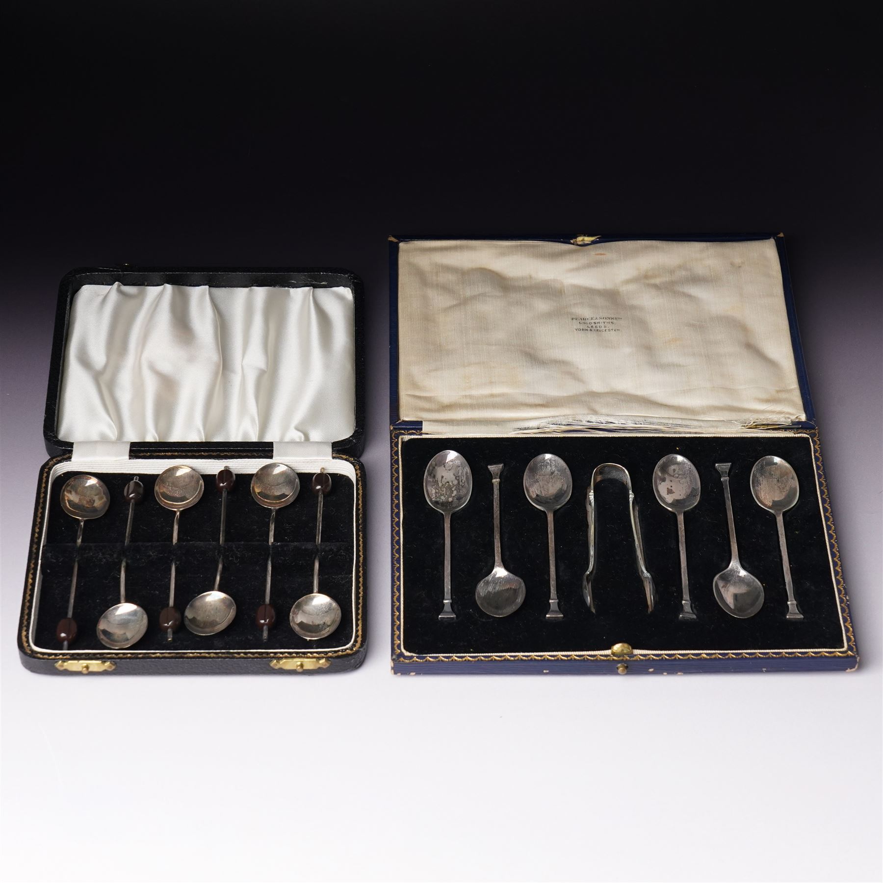 Set of six silver seal top coffee spoons and tongs Sheffield 1924 Maker Cooper Bros & Sons Ltd, cased and a set of six silver bead knop coffee spoons, cased