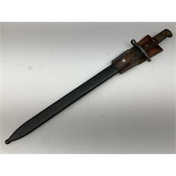 Swiss Schmidt-Rubin M1914 pioneer bayonet, with 48cm steel saw-back blade, the ricasso stamped, ''Waffenfabrik, Neuhausen'', the crosspiece stamped Swiss cross, steel scabbard, leather frog L64cm overall