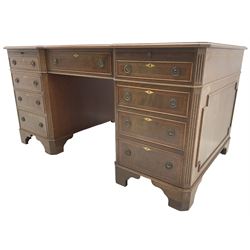 Mid -20th century Georgian design mahogany twin pedestal desk, moulded reverse breakfront top with three sectional inset leather top, fitted with single frieze drawer flanked by eight graduating cock-beaded drawers, each with corssbanded and strung facias, with fluted canted corners, on bracket feet