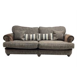 'Canterbury' Grande four seat sofa upholstered in brown fabric with contrasting textures, traditional shape with scrolled arms and studded bands, on turned feet (two sectional)
