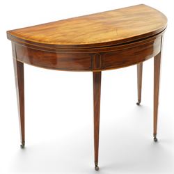 George III inlaid mahogany demi-lune card table, the hinged lunette top inlaid with satinw...