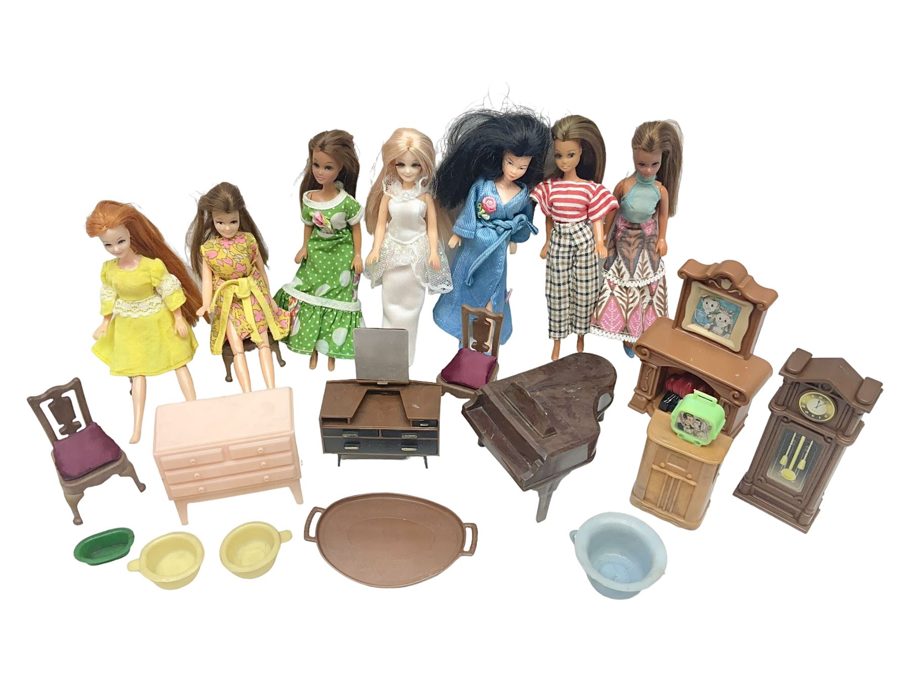Seven Pippa dolls and a collection of plastic dolls house furniture Toys Models