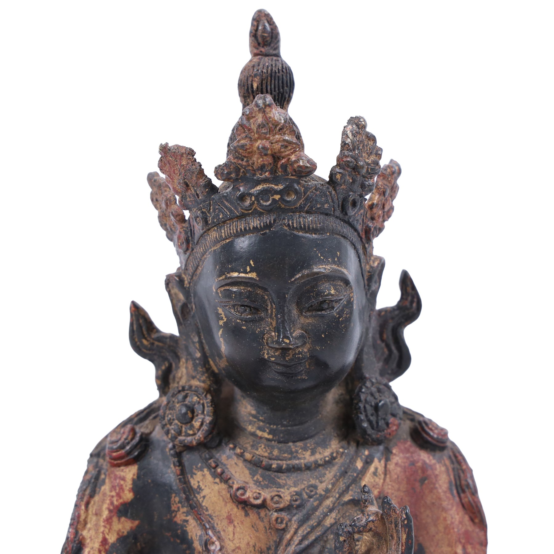 20th century bronzed buddha, with one hand raised, seated upon a lotus leaf, H27cm